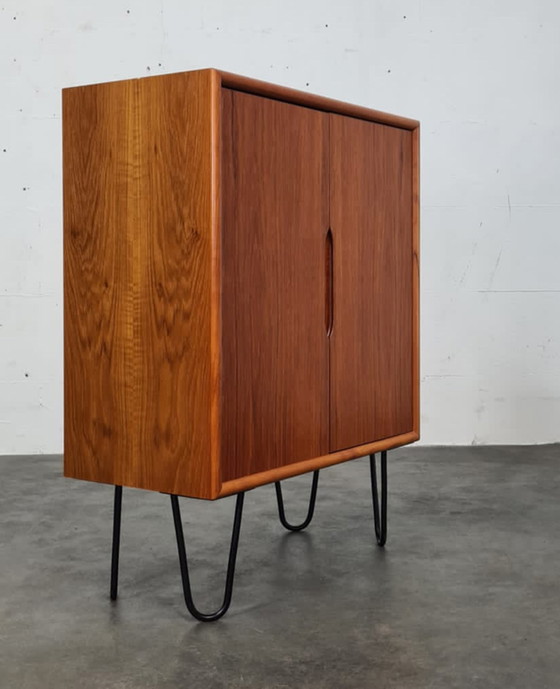 Image 1 of Vintage teak hairpin cabinet