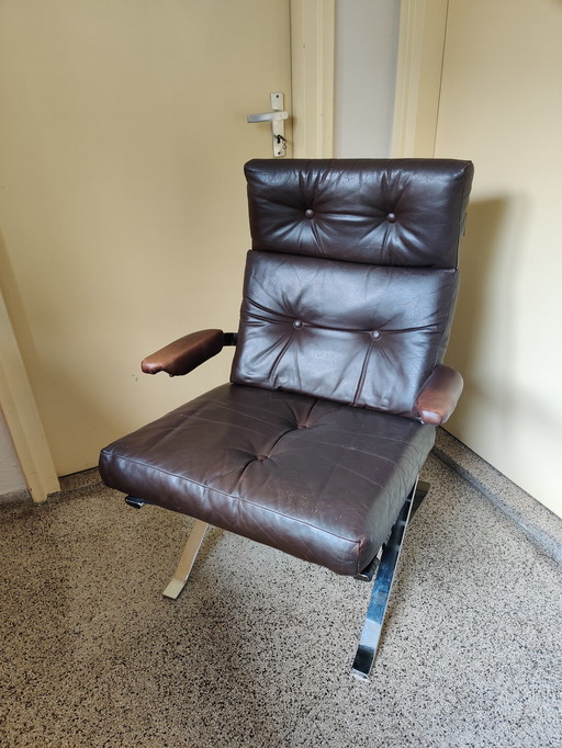 Leather armchair on chrome frame