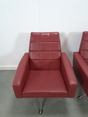 Vintage burgundy swivel armchair