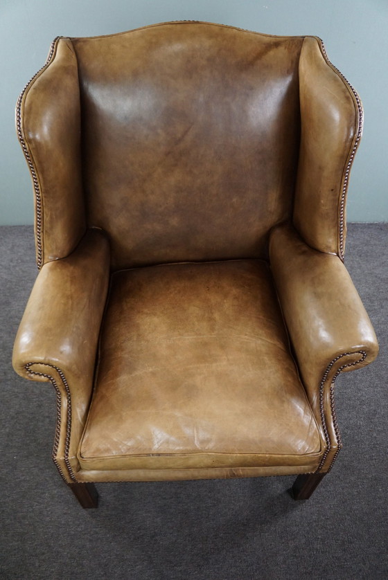 Image 1 of Spacious cowhide leather wing chair in very good condition