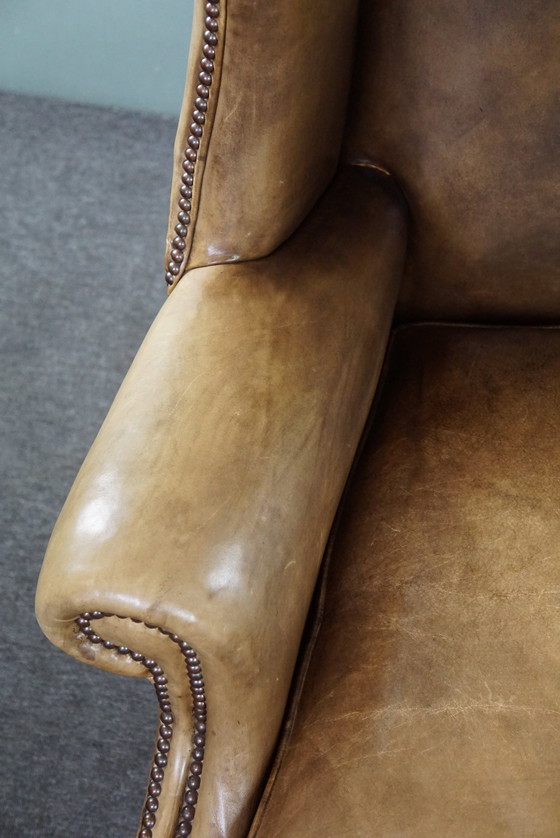 Image 1 of Spacious cowhide leather wing chair in very good condition