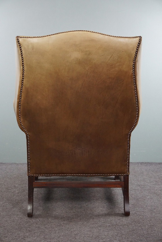 Image 1 of Spacious cowhide leather wing chair in very good condition