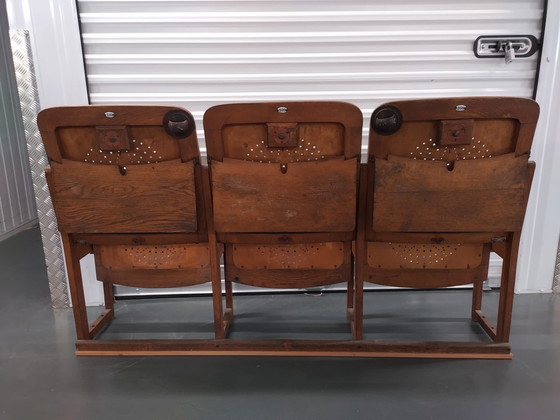 Image 1 of 3x auction chairs with folding table on the back