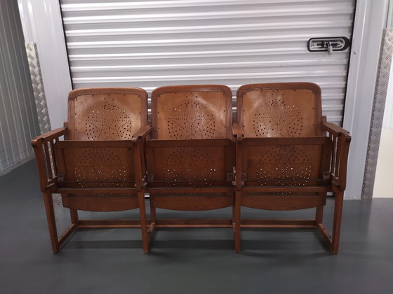 Image 1 of 3x auction chairs with folding table on the back