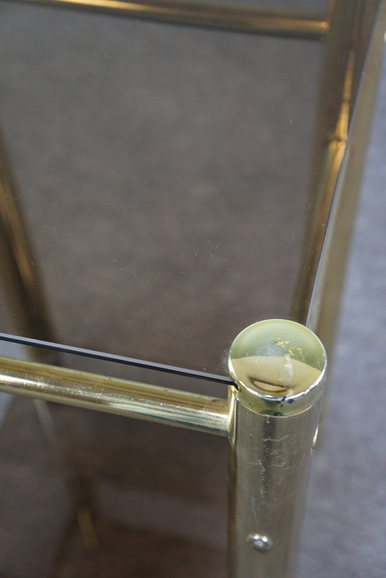 Image 1 of Gold Hollywood Regency smoked glass side table, column