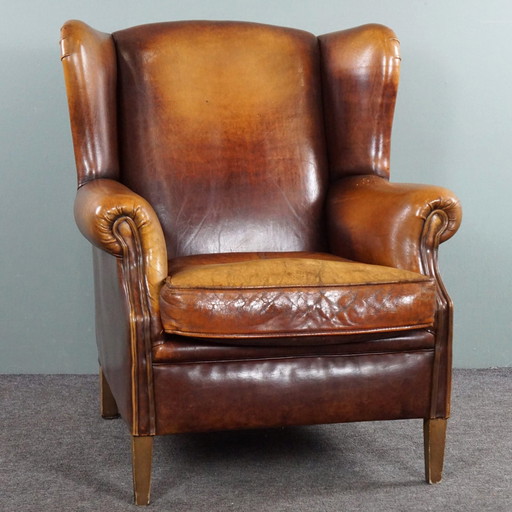 Fauteuil à oreilles en cuir de mouton marron