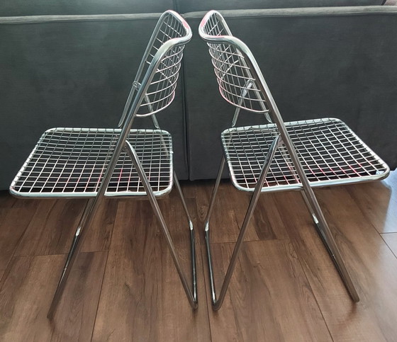 Image 1 of 2x Niels Gammelgaard wire folding chairs.