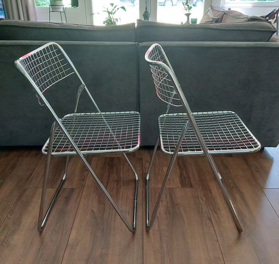 Image 1 of 2x Niels Gammelgaard wire folding chairs.