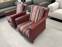 2 Leolux Paian swivel armchairs in red leather 