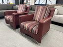 2 Leolux Paian swivel armchairs in red leather 