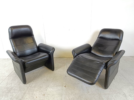 2x Vintage black leather reclining armchairs