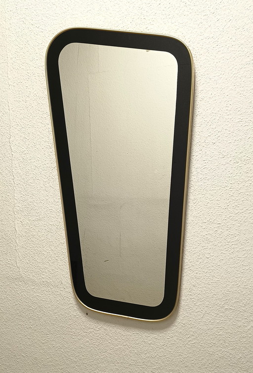 Miroir des années 50 de forme inhabituelle avec un large bord noir