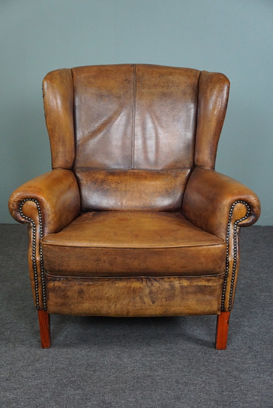 Image 1 of Well-fitting sheepskin leather wing chair