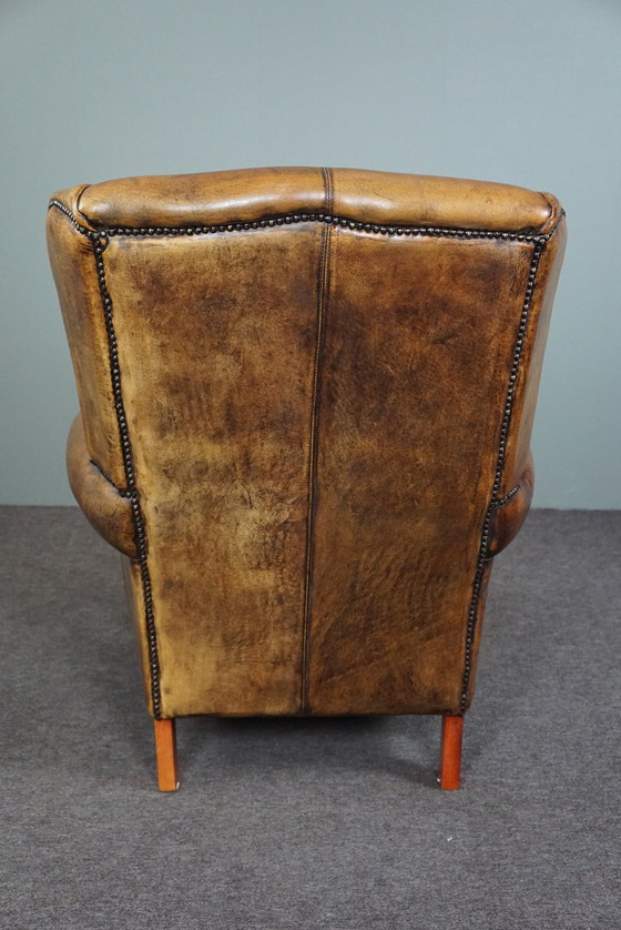 Image 1 of Well-fitting sheepskin leather wing chair