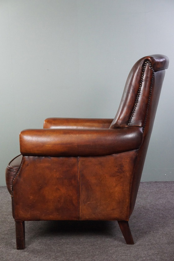 Image 1 of Sheep leather armchair with high back and in good condition