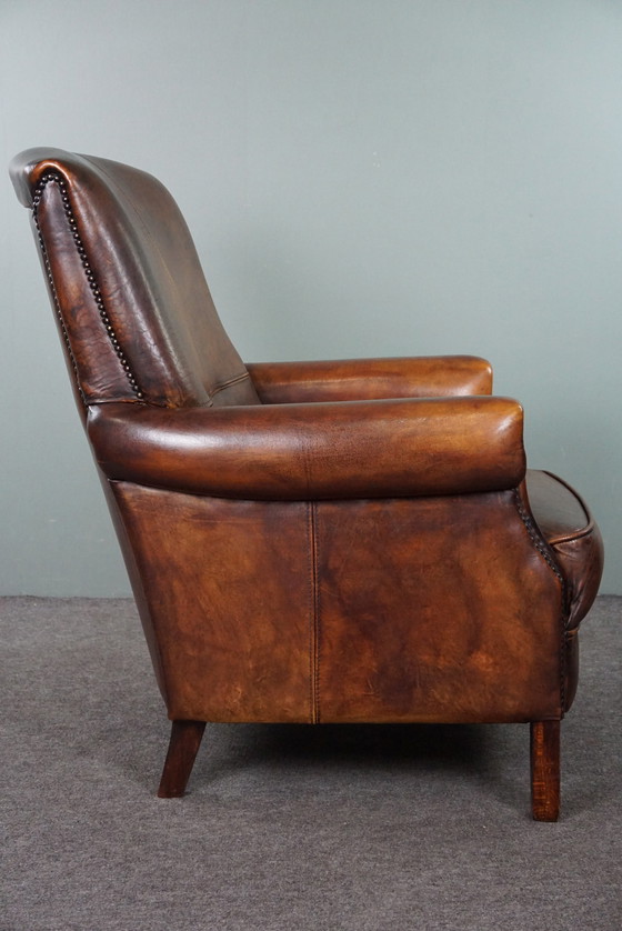 Image 1 of Sheep leather armchair with high back and in good condition