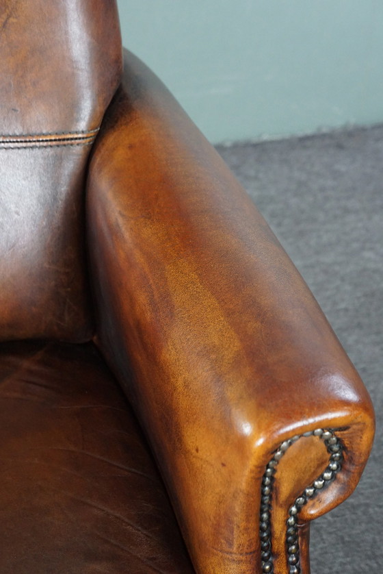 Image 1 of Sheep leather armchair with high back and in good condition