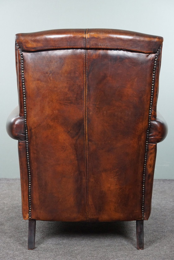 Image 1 of Sheep leather armchair with high back and in good condition