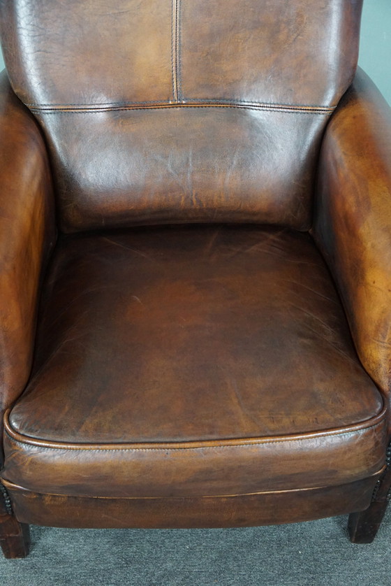 Image 1 of Sheep leather armchair with high back and in good condition