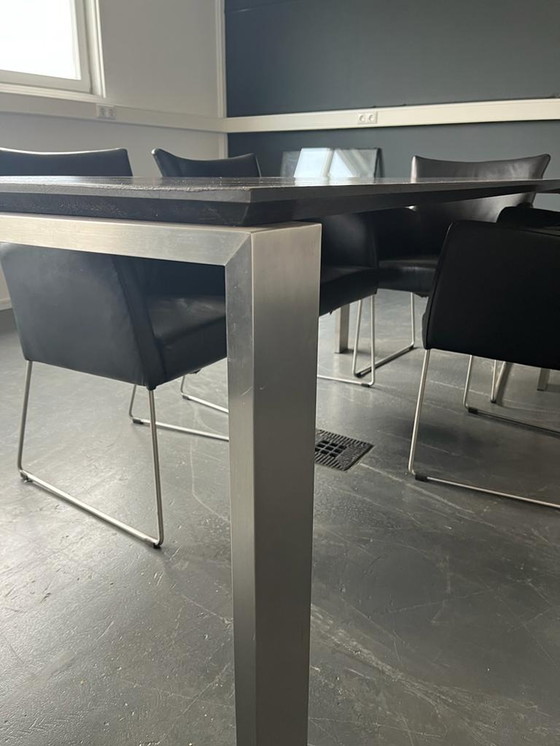 Image 1 of Dining table with stainless steel legs and black leather 6x chairs