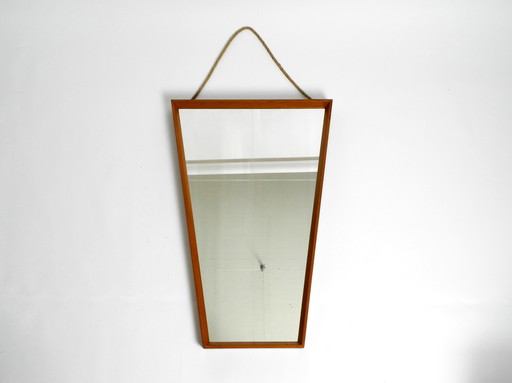 Beautiful large Mid Century wall mirror in trapezoidal shape with a solid cherry wood frame