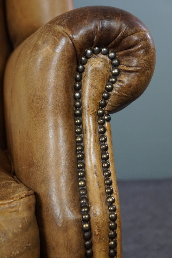 Image 1 of Fauteuil à oreilles en cuir de mouton clair