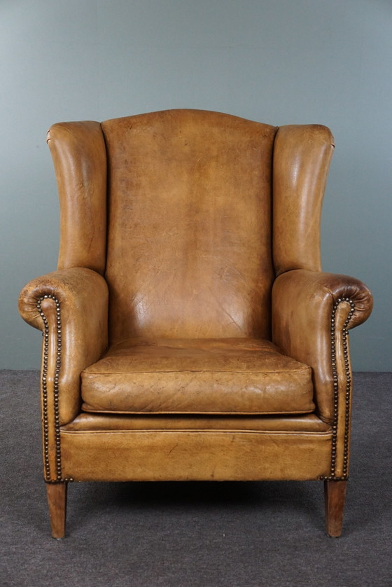 Image 1 of Fauteuil à oreilles en cuir de mouton clair