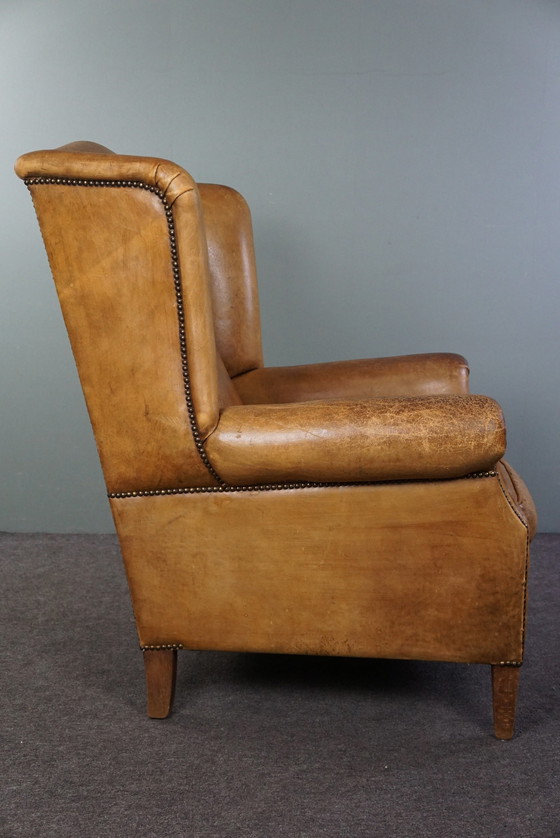 Image 1 of Fauteuil à oreilles en cuir de mouton clair