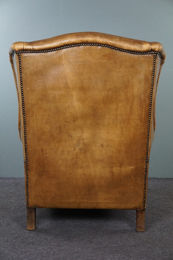 Image 1 of Fauteuil à oreilles en cuir de mouton clair