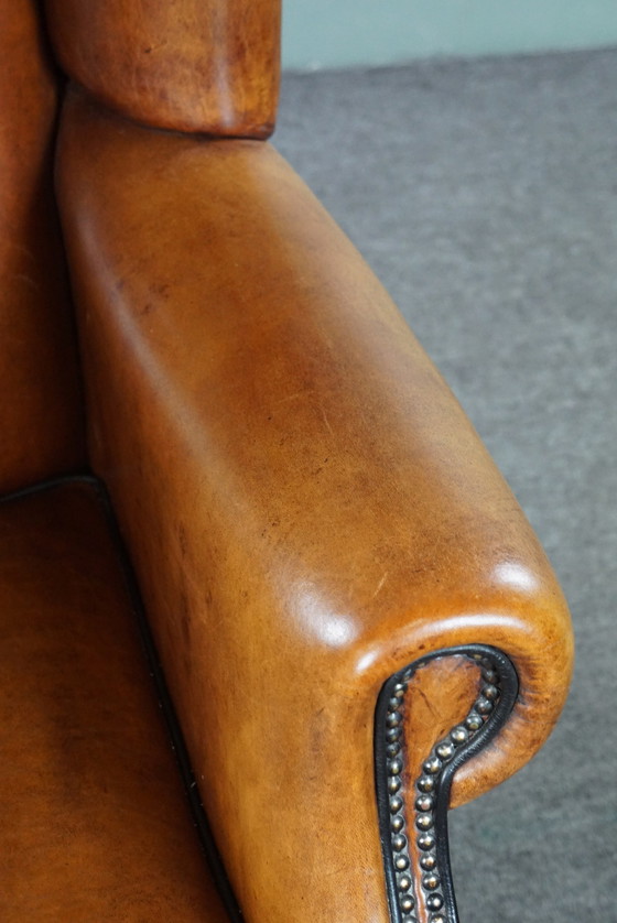 Image 1 of Grand fauteuil à oreilles en cuir de mouton