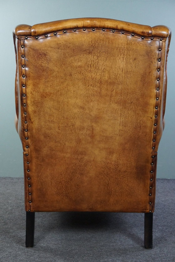 Image 1 of Grand fauteuil à oreilles en cuir de mouton