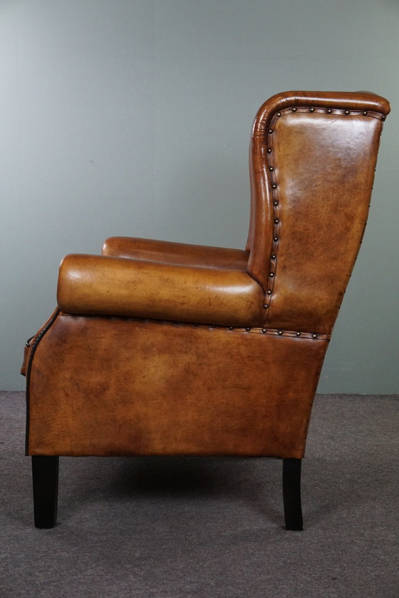 Image 1 of Grand fauteuil à oreilles en cuir de mouton