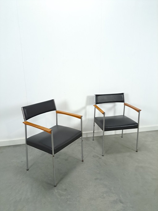 GDR chairs with chrome base and black upholstery