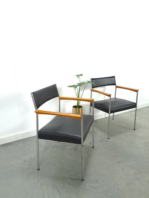 GDR chairs with chrome base and black upholstery