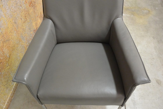 Image 1 of Gray leather Design on Stock Limec armchair