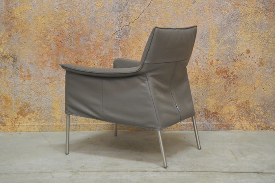 Image 1 of Gray leather Design on Stock Limec armchair