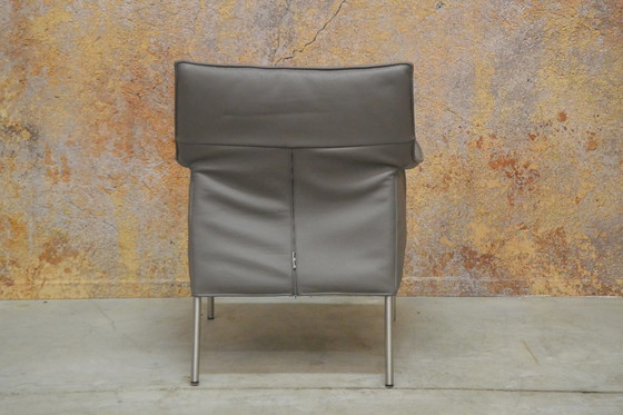 Image 1 of Gray leather Design on Stock Limec armchair