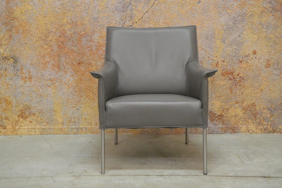 Image 1 of Gray leather Design on Stock Limec armchair