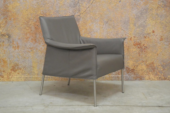 Image 1 of Gray leather Design on Stock Limec armchair