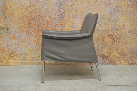 Image 1 of Gray leather Design on Stock Limec armchair