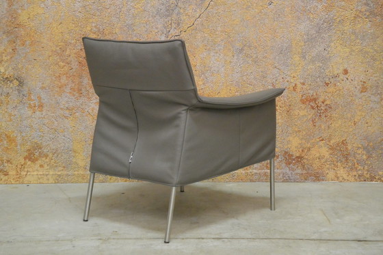 Image 1 of Gray leather Design on Stock Limec armchair