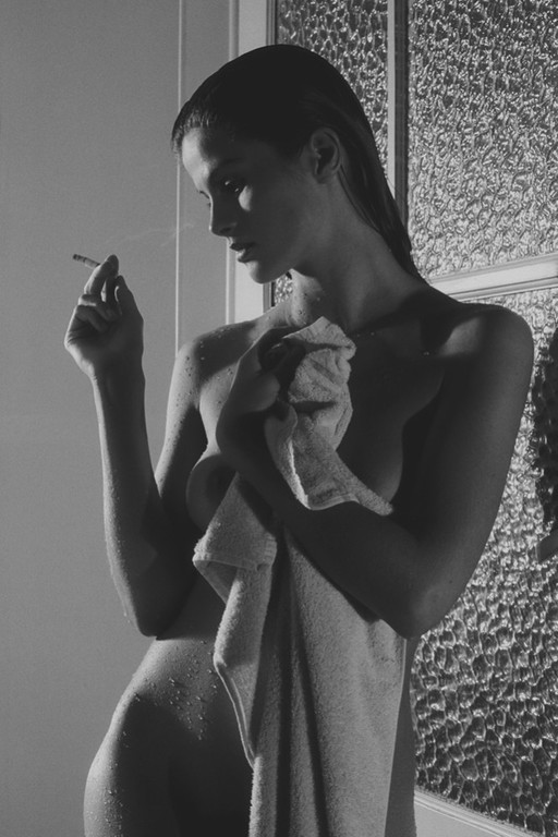 Alain Daussin: Female nude with a cigarette after the shower