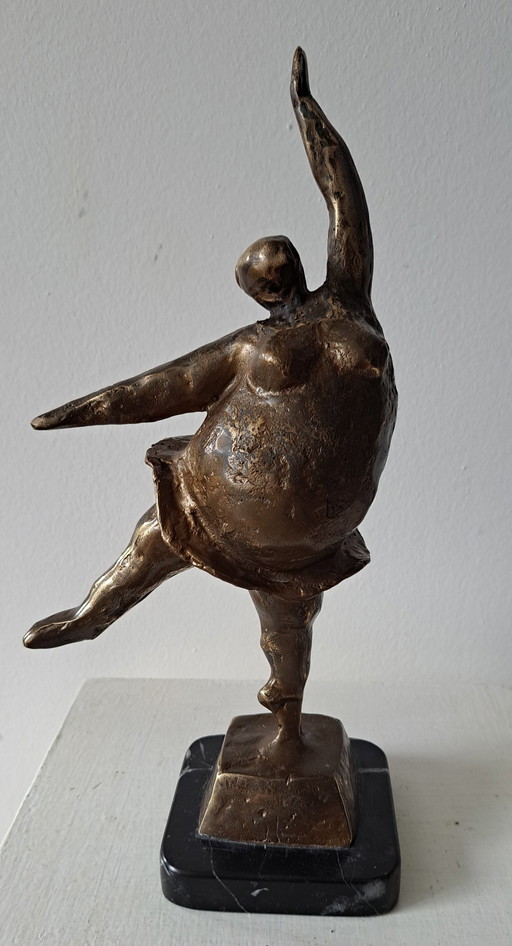 Cheerful dancing woman figurine