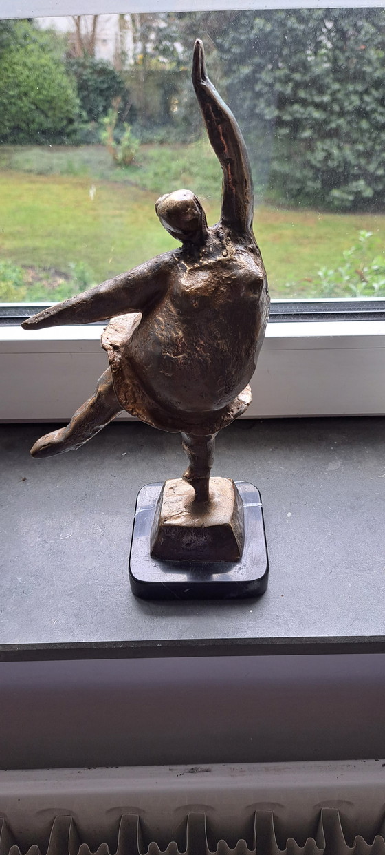 Image 1 of Cheerful dancing woman figurine