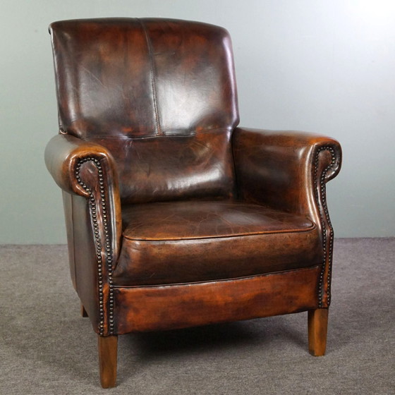 Image 1 of Fauteuil majestueux en cuir de mouton, assise confortable et dossier haut