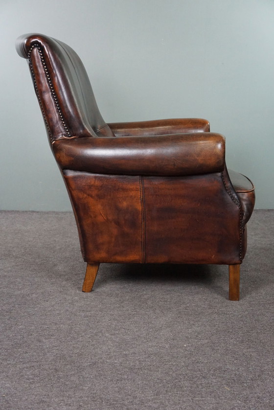 Image 1 of Fauteuil majestueux en cuir de mouton, assise confortable et dossier haut