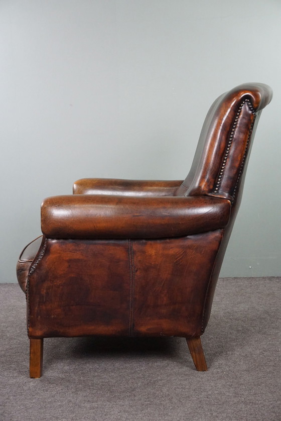 Image 1 of Fauteuil majestueux en cuir de mouton, assise confortable et dossier haut