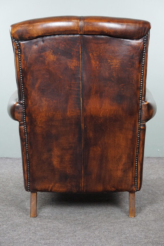 Image 1 of Fauteuil majestueux en cuir de mouton, assise confortable et dossier haut