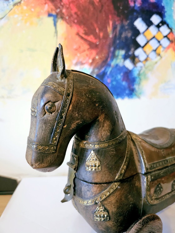 Image 1 of Vintage carved wood horse figurine with brass elements.