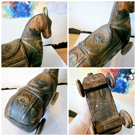 Image 1 of Vintage carved wood horse figurine with brass elements.